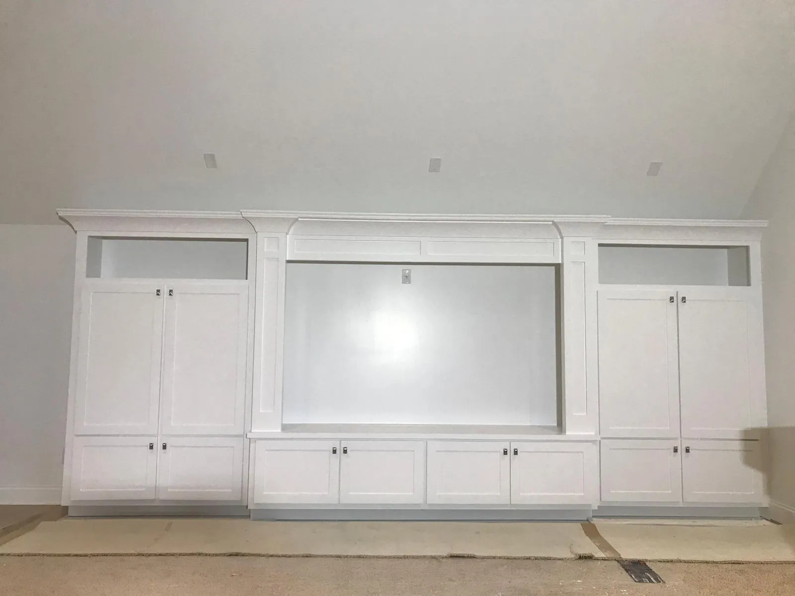 Finished built-in media wall with shelving
