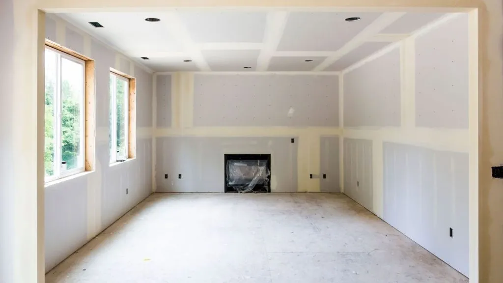 Drywall finished around a fireplace surround
