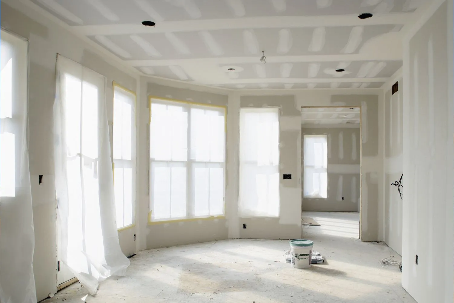 Sunroom with drywall hung and finished, ready for paint